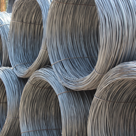 Plain Wire rolls stacked together outside steel supplies